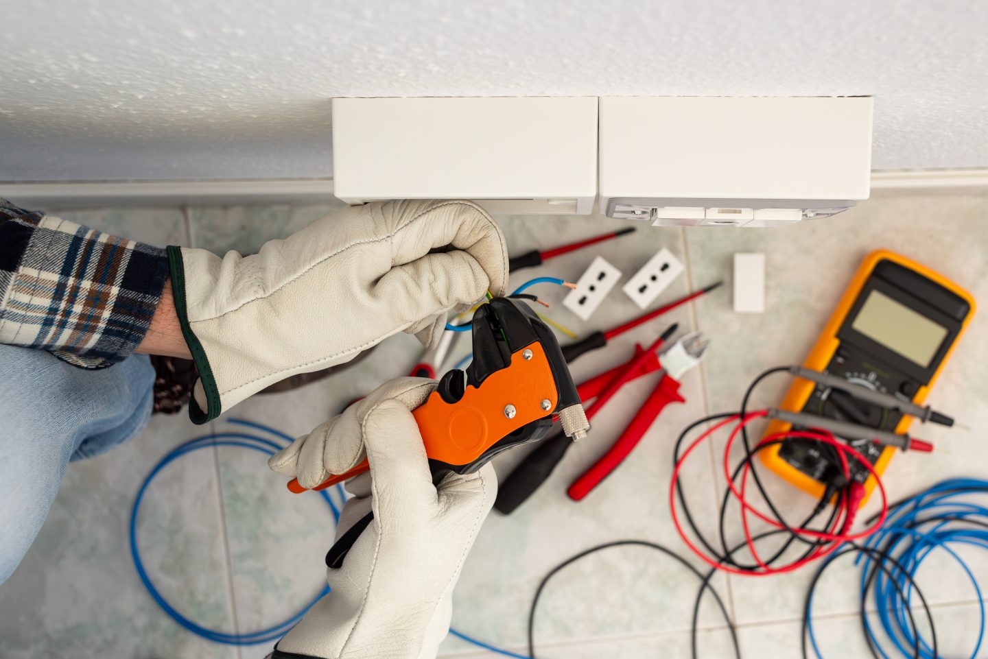 N1 Services electrician performing an electrical repair in a Lee's Summit home