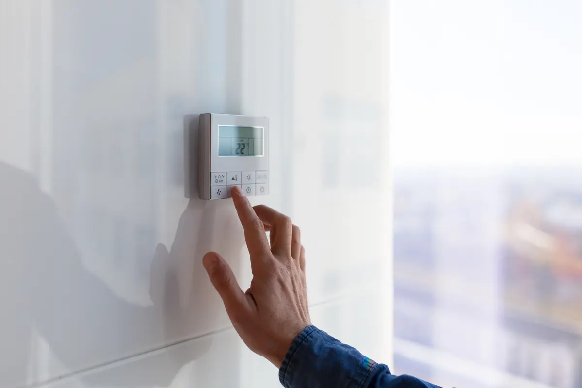 HVAC technician servicing a home heating and cooling system